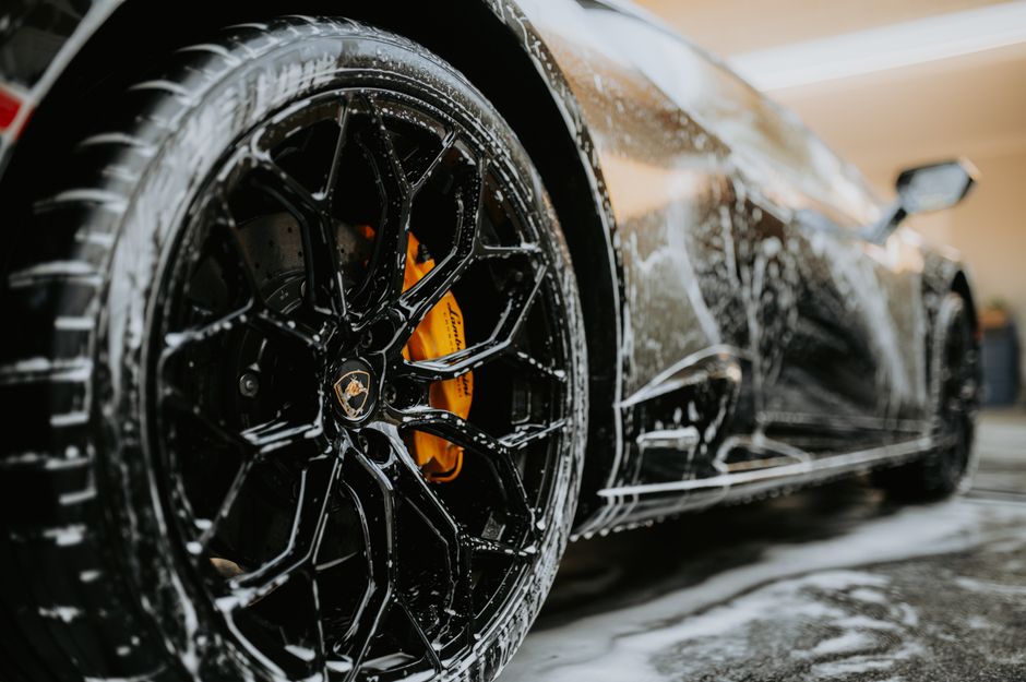 Luxury vehicle receiving a premium car wash